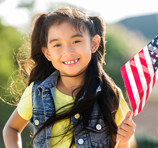 young girl with american flag