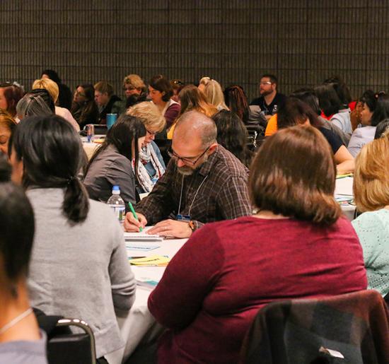 NAEYC conference attendees participating in a session. 