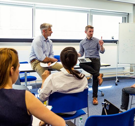 Students and teachers in a learning environment.