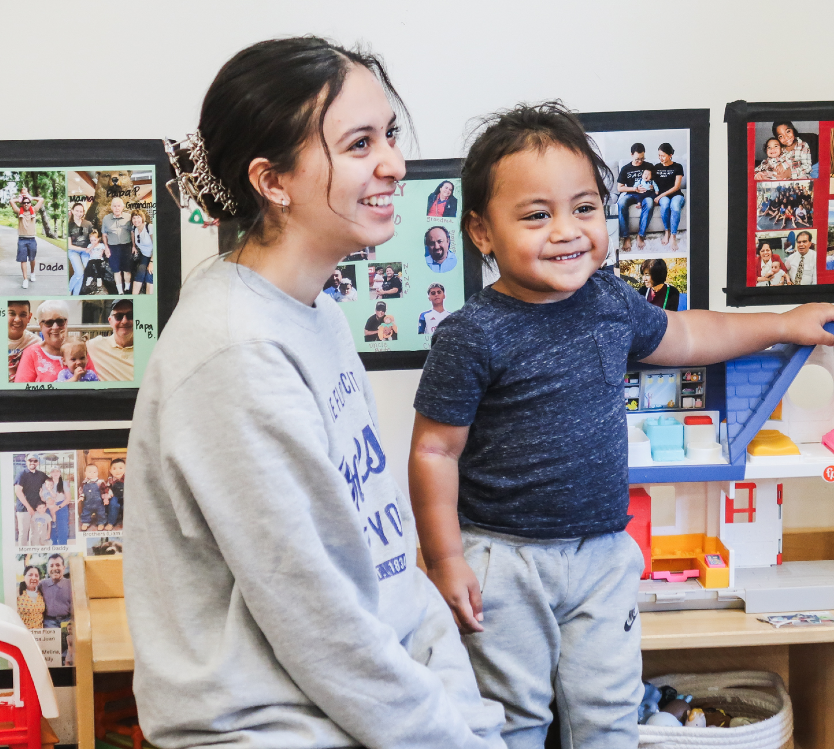 A teacher working with a student in a classroom
