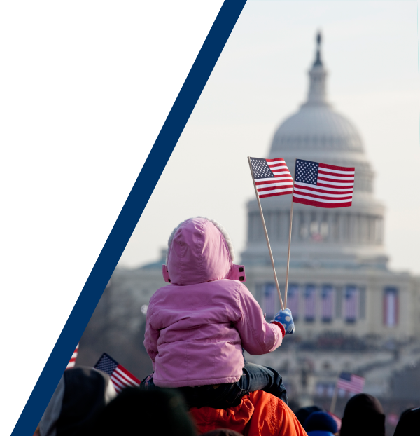 child waving flag infront of the US capitol building