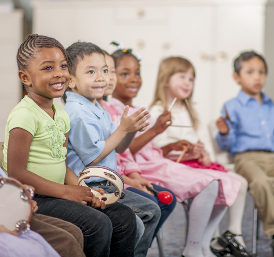 preschool students playing musical instruments