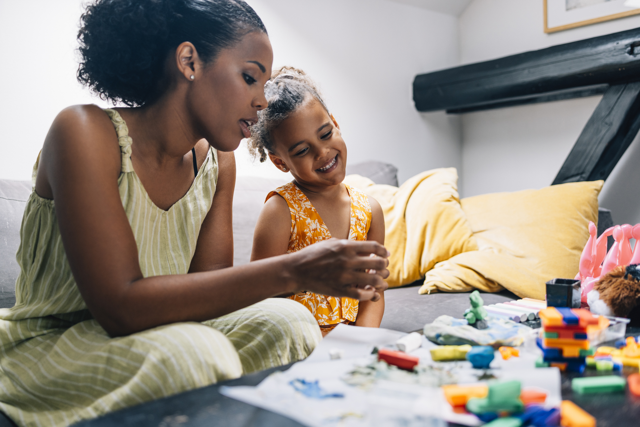 Mother helping her daughter with a project