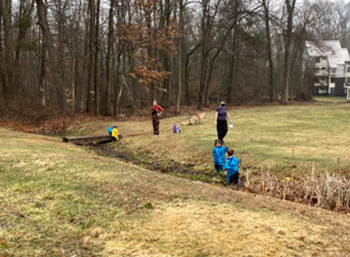 Children explore the stream.