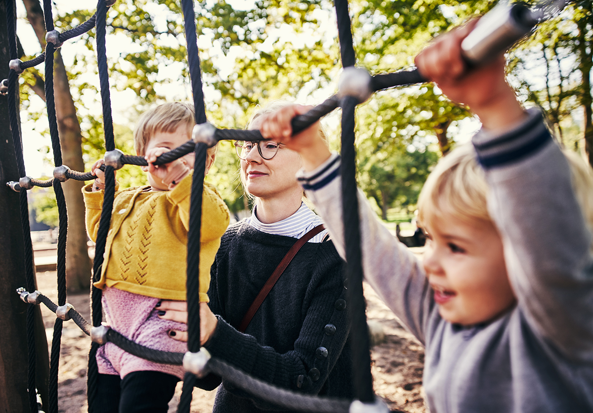 Parent with children on playground