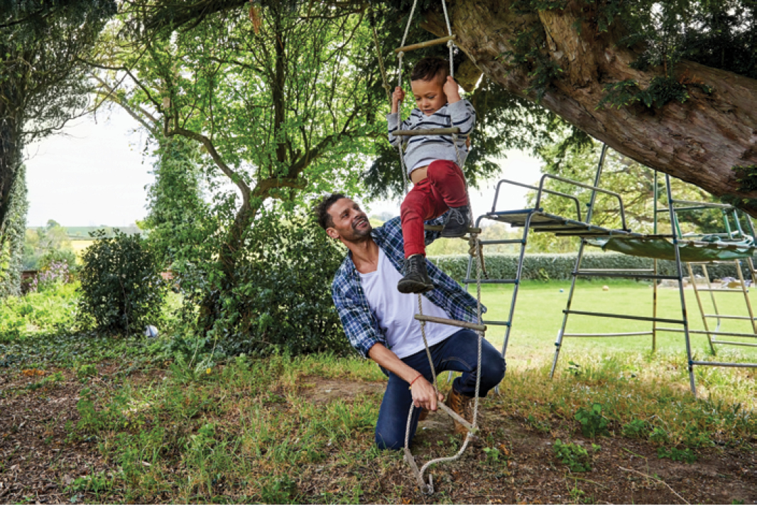 A child climbs outdoors.