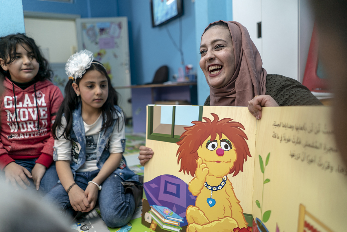 Syrian teacher with students