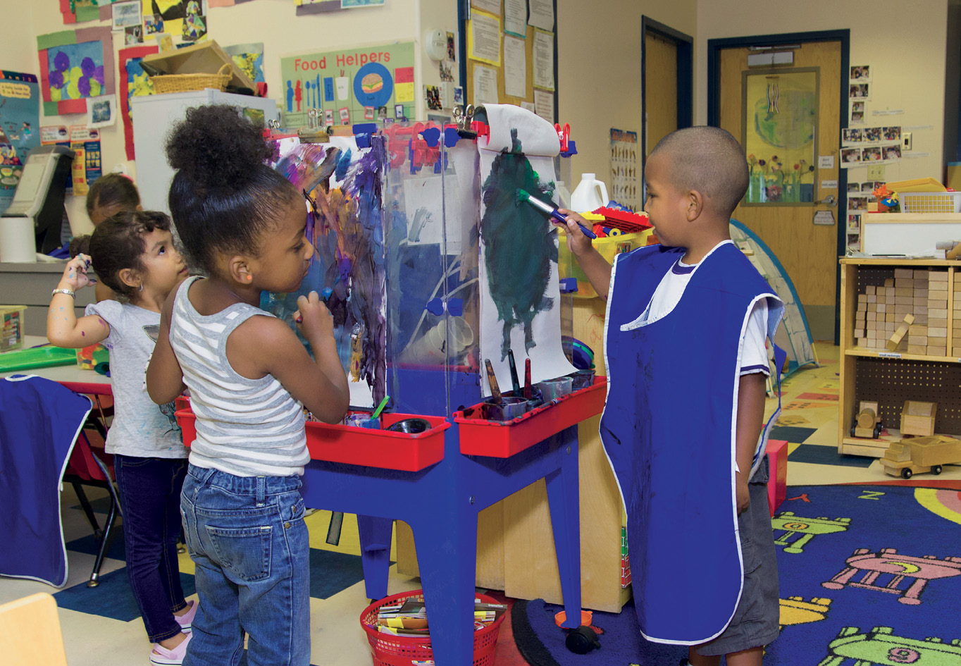 Three students painting