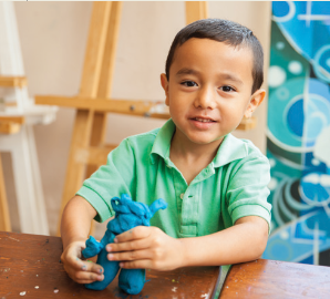 Boy playing with playdoh