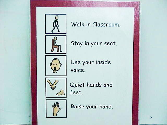 Poster featuring info graphics depicting "walk in classroom," "stay in your seat," "use your inside voice," "quiet hands and feet," and "raise your hand." 