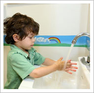 Young kid washing hands