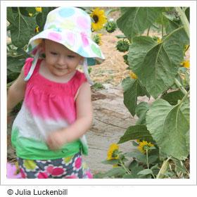 Toddler playing in garden