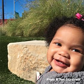 Girl smiling and playing outside