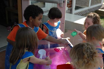 Kindergartners together learning about new academic content