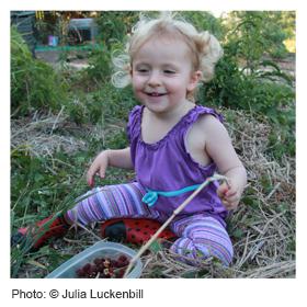 Girl in a vegetable garden