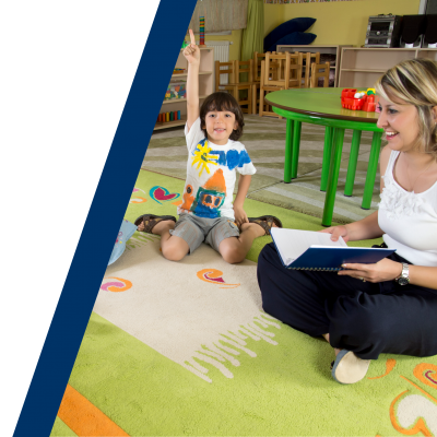 teacher reading to children in a classroom