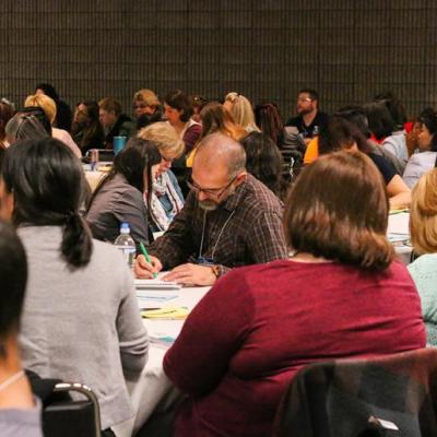 NAEYC conference attendees participating in a session.
