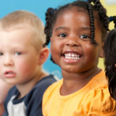 Group of young children in a classroom.