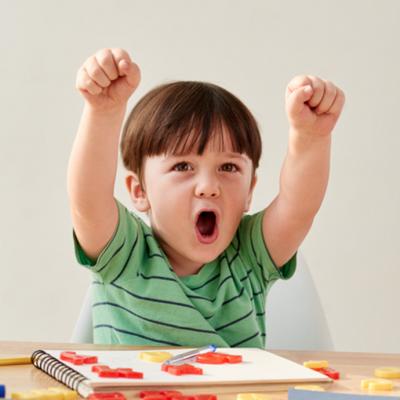 excited boy with arms up