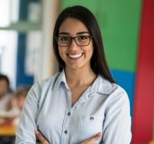 Teacher standing in classroom