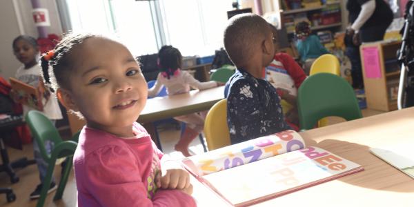 Young girl reading a book