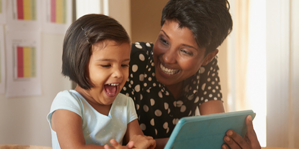 Mother and daughter with ipad/tablet