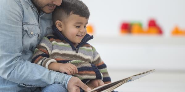 a dad reading to a child