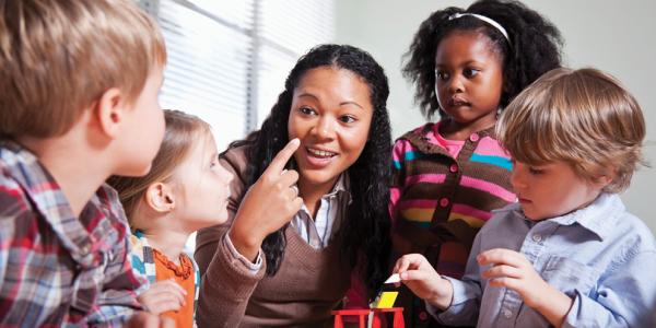 Teacher and students at table