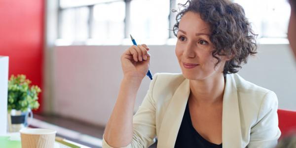 Woman in a meeting setting. 