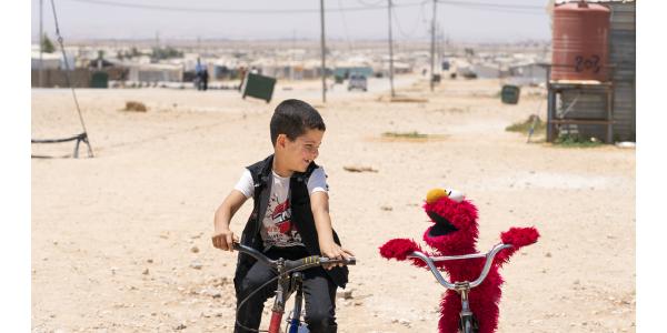 boy with Elmo in Syria