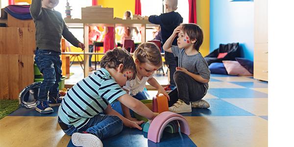 A group of children playing with toys.