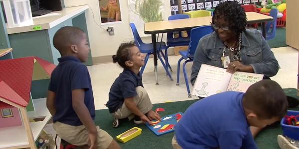 a teacher reading to children