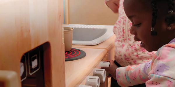 children in a play kitchen