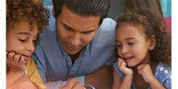 Father reading to son and daughter