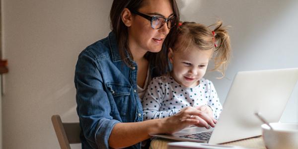 Mother and daughter looking at a digital tablet