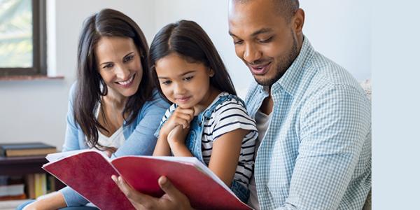 Mother, Father and Daughter reading