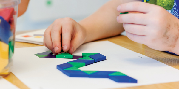 Child playing with shapes