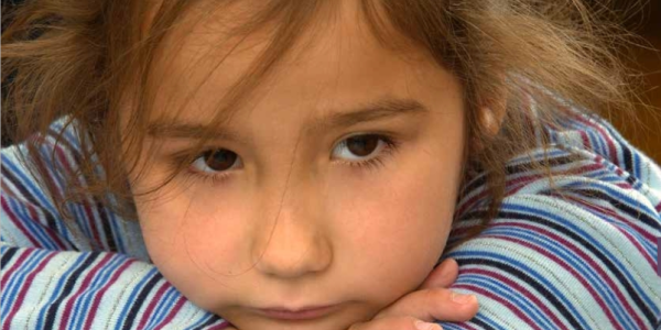 Girl resting her head on her arms