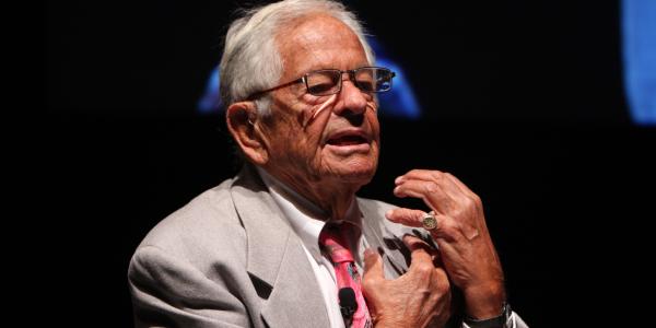 Dr. T. Berry Brazelton speaking at a conference.