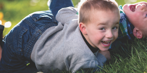 Two children playing outdoors 