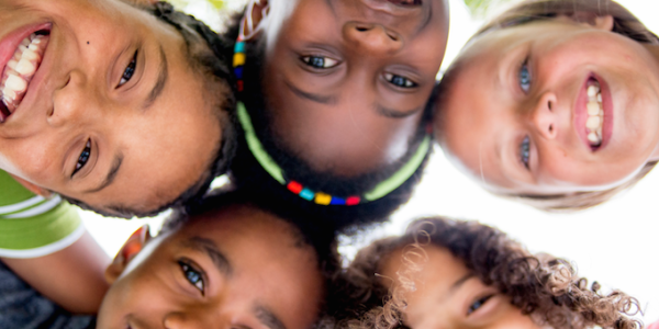 Four diverse children in circle