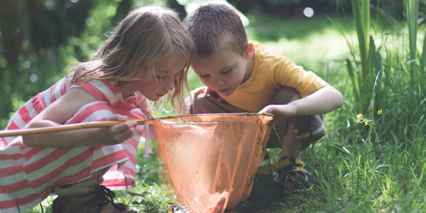 Two children playing outdoors 