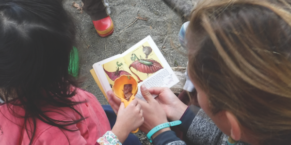 Teacher and student at a preschool in the park