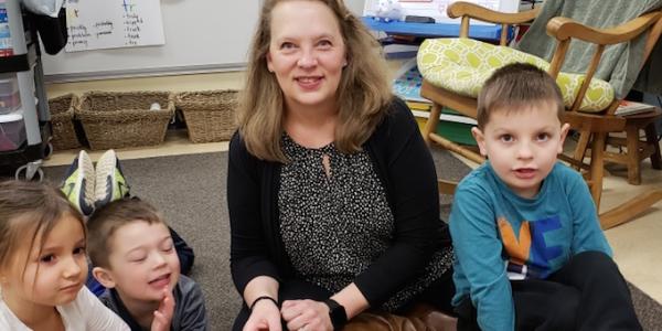 Preschool teacher with students