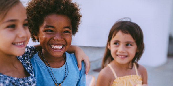 Three children smiling