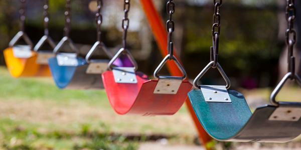 empty swing sets on a playground