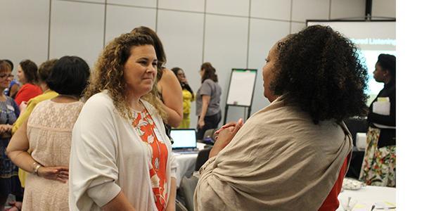 A group of people at a conference