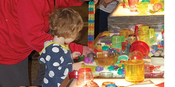 Preschool child playing at table