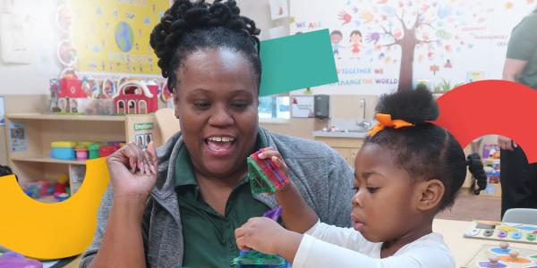 A teacher working with a student in the classroom
