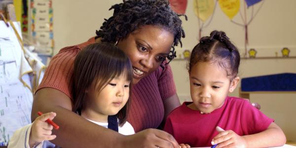 Teacher working with students